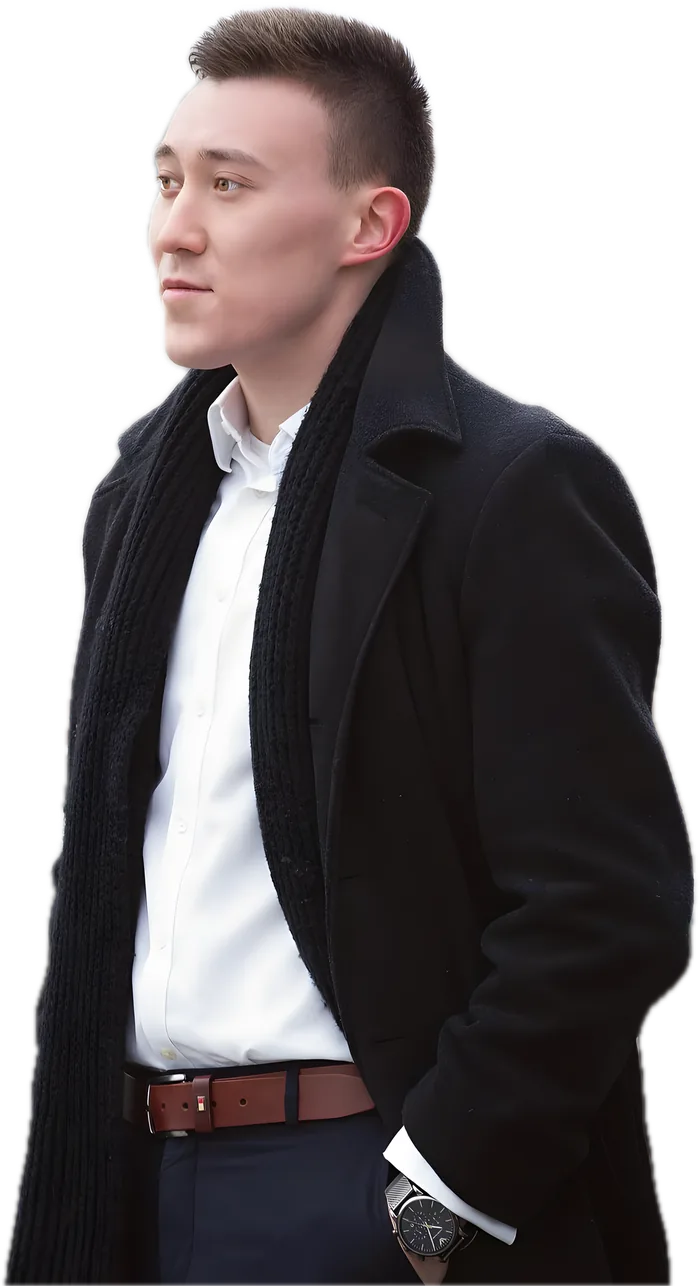 Arthur in a black coat and white shirt, looking into the distance