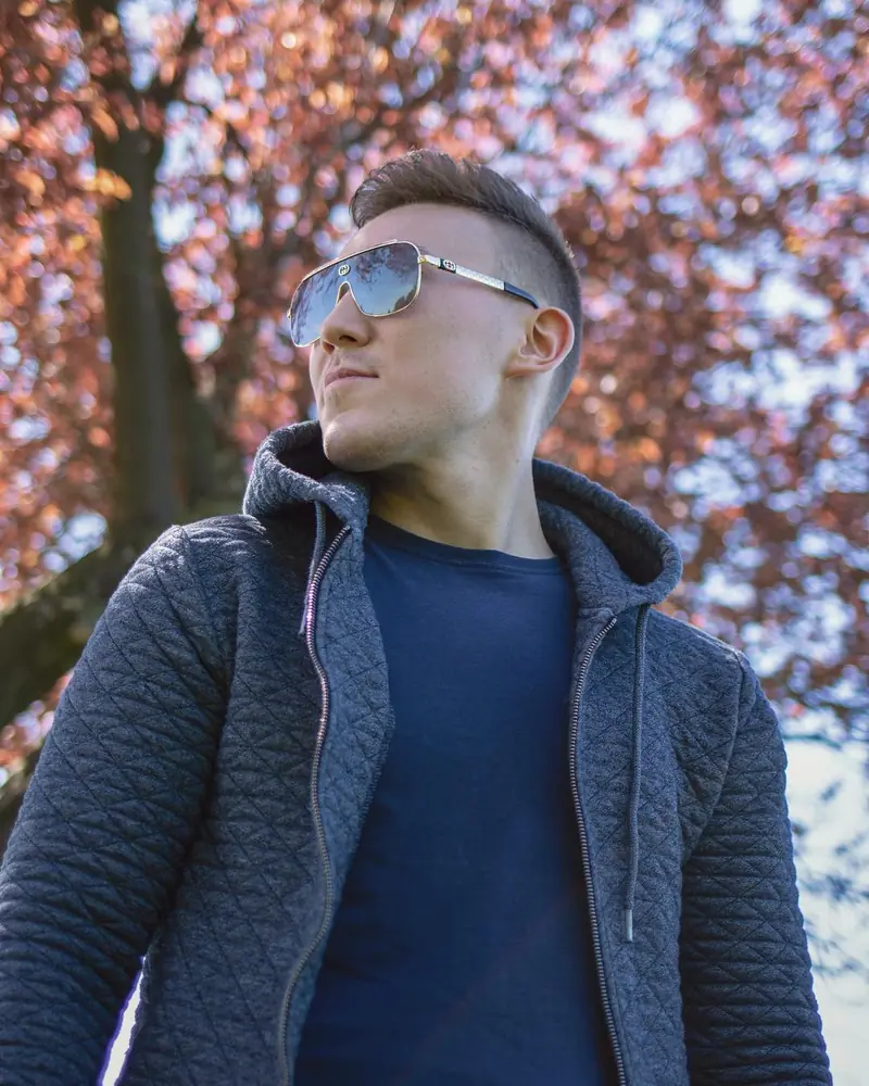Arthur in sunglasses under cherry blossoms